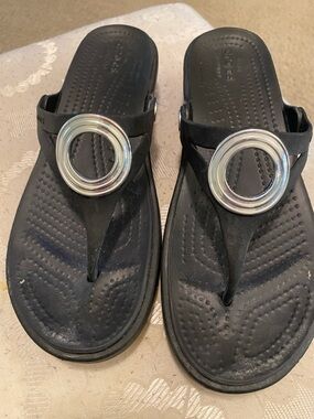 CROCS Black Thong Sandals with Silver Ring Accent